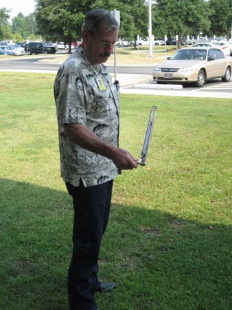 man with clinometer